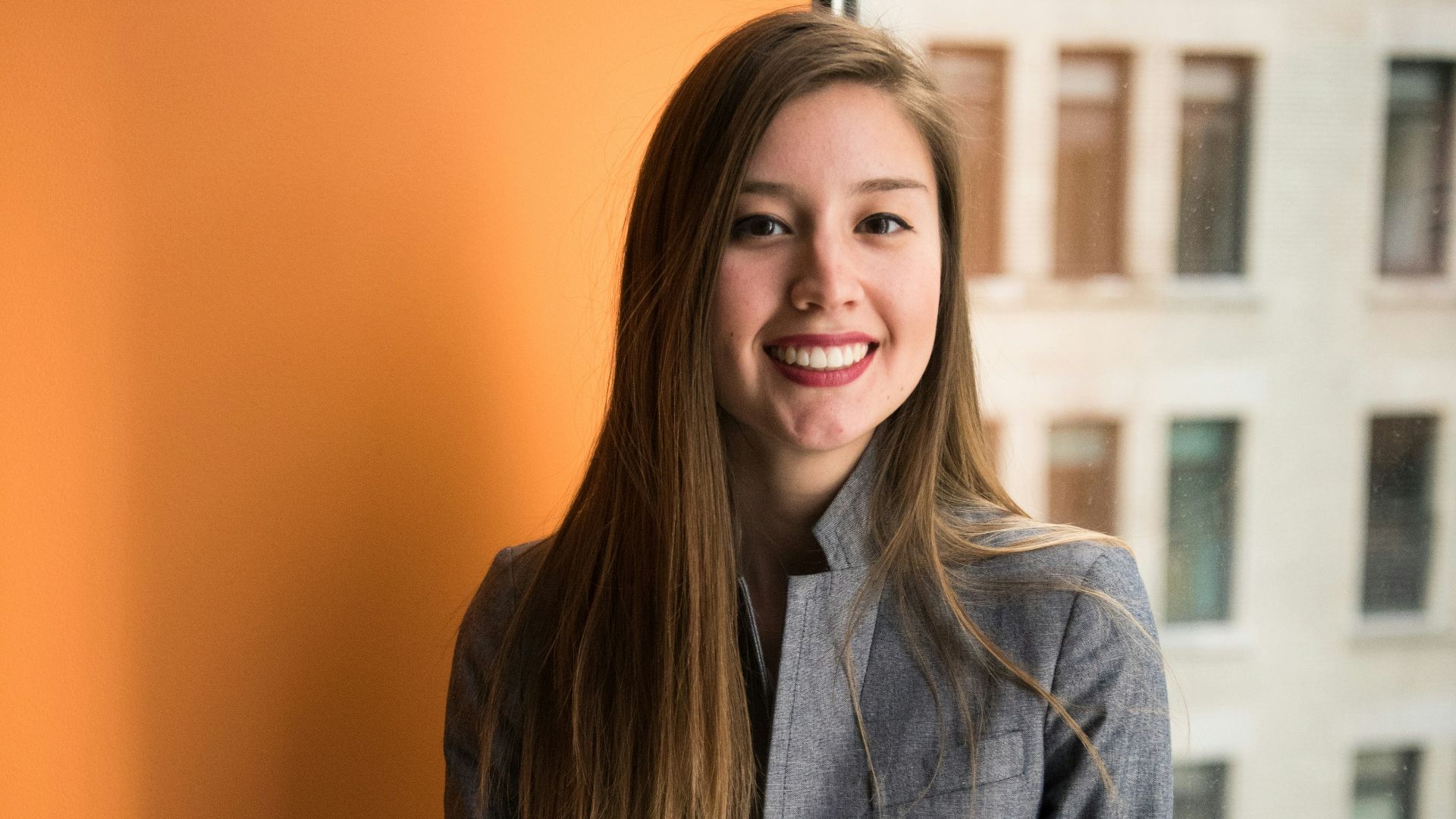 shallow focus photo of woman in gray jacket