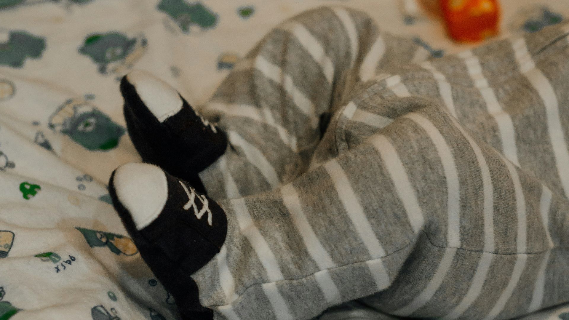 black and white panda plush toy on white and black textile