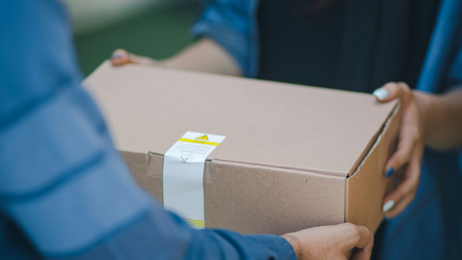 person giving brown box