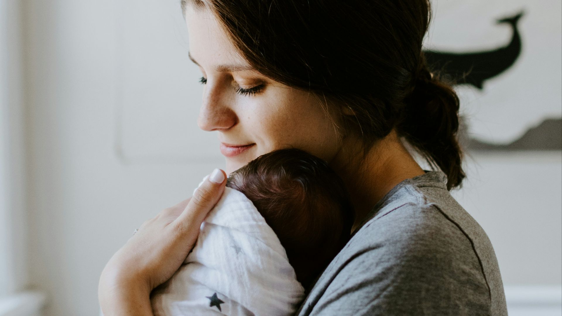mother carrying baby
