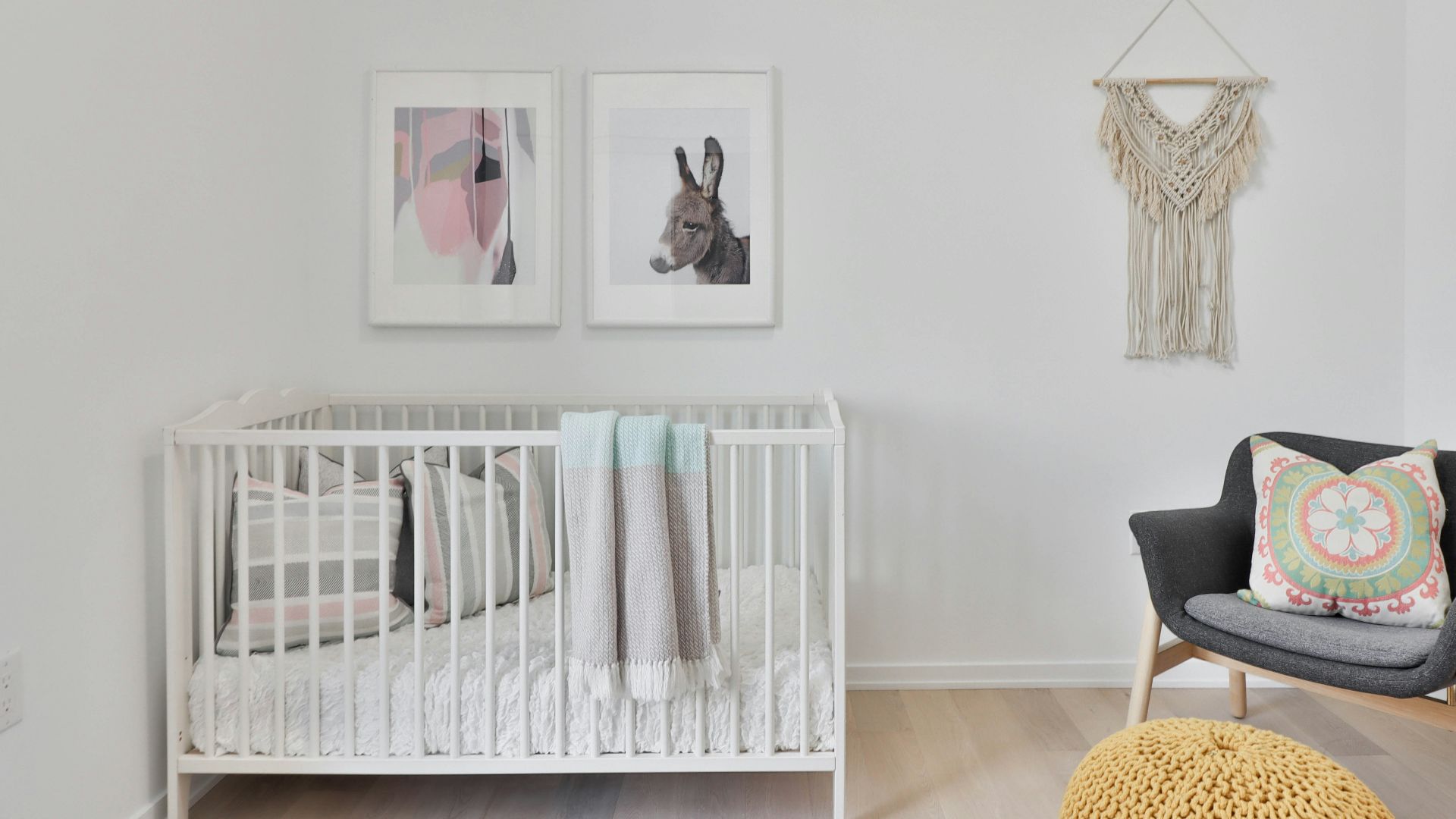 a bedroom with a bed and a chair in a room