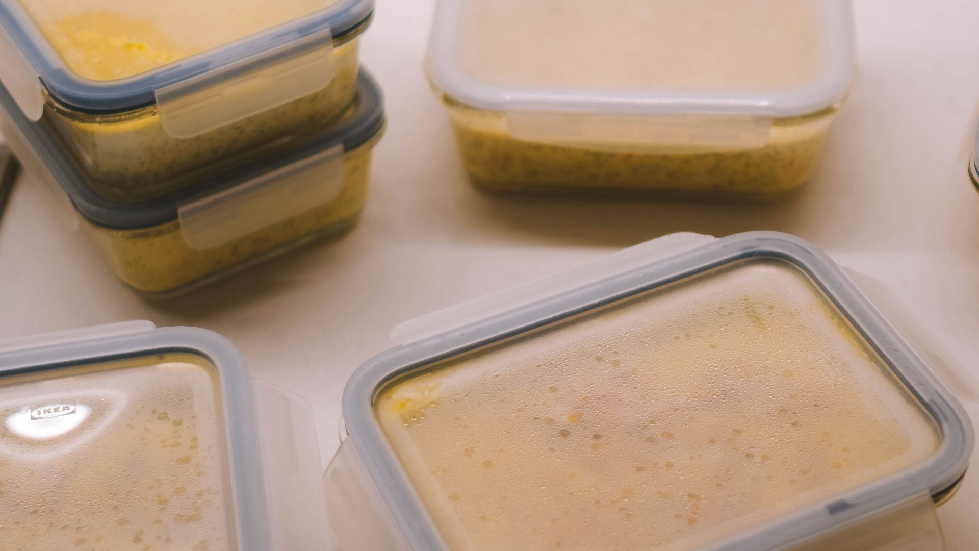 white plastic food container on white table