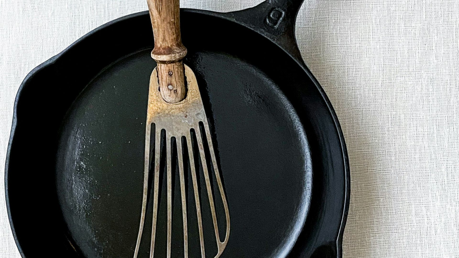 brown handle fork on black round plate