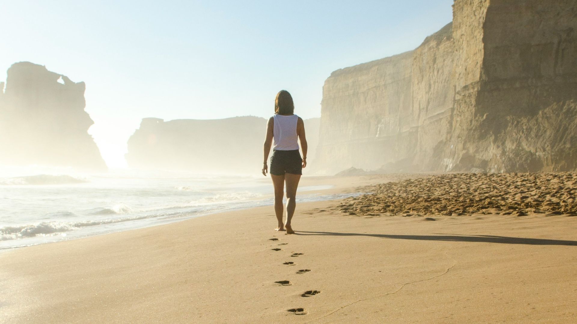 woman walking on shore