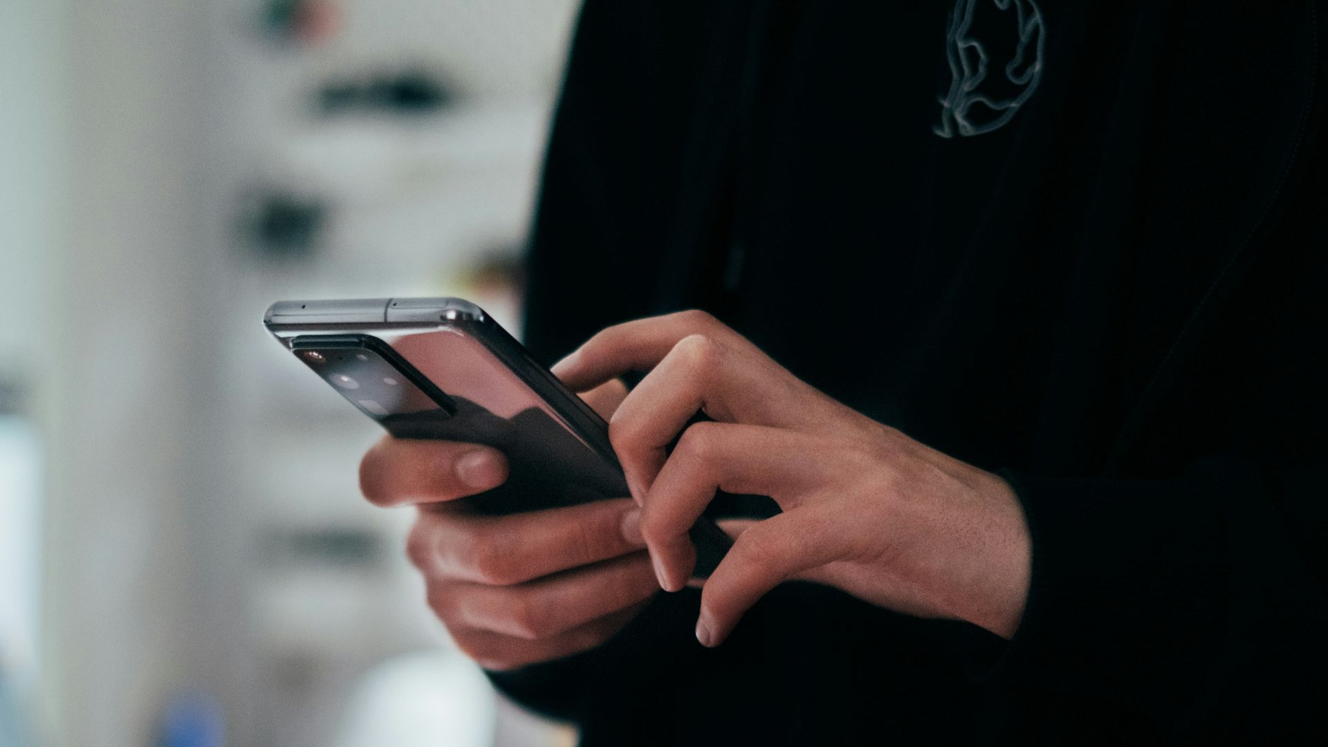 person holding black android smartphone