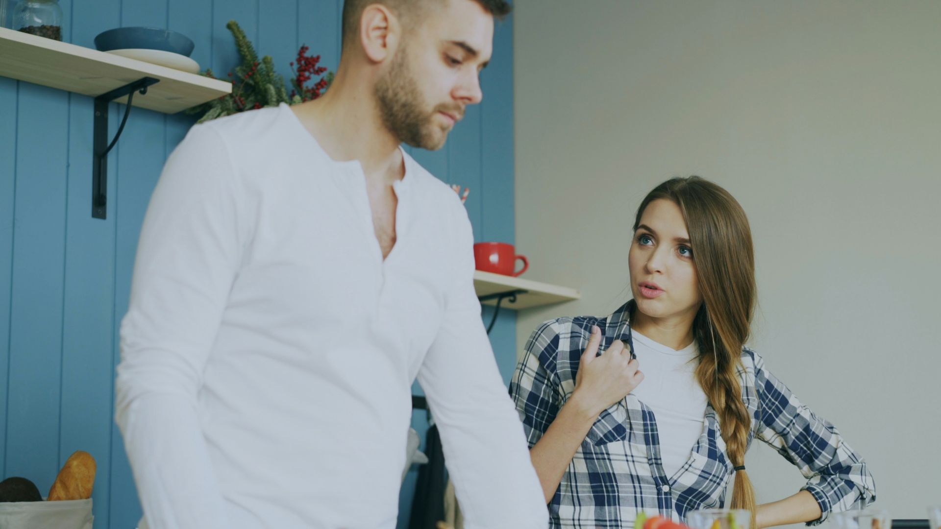 Couple arguing in a kitchen
