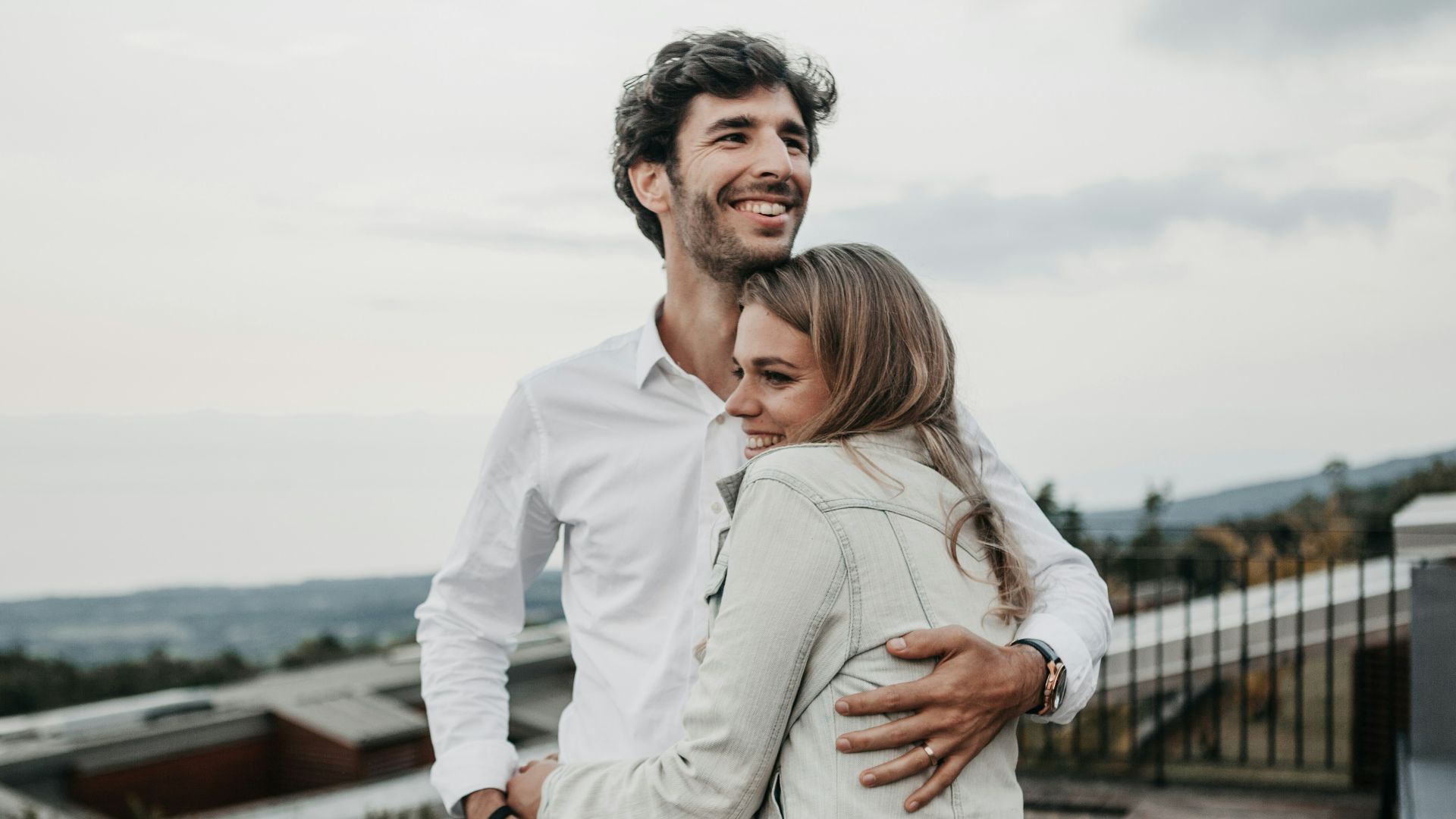 man and woman hugging each other