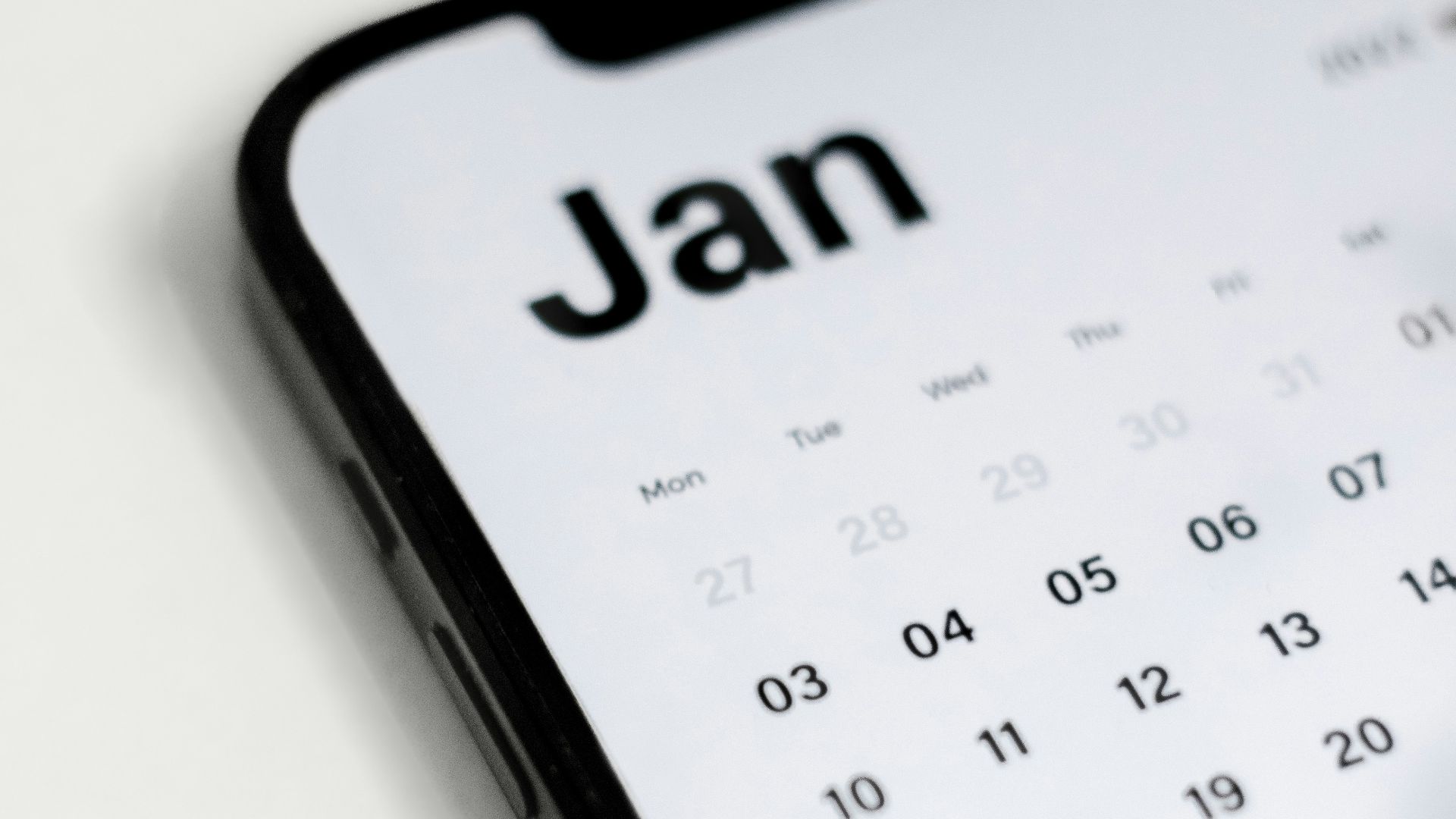 a close up of a cell phone with a calendar on it