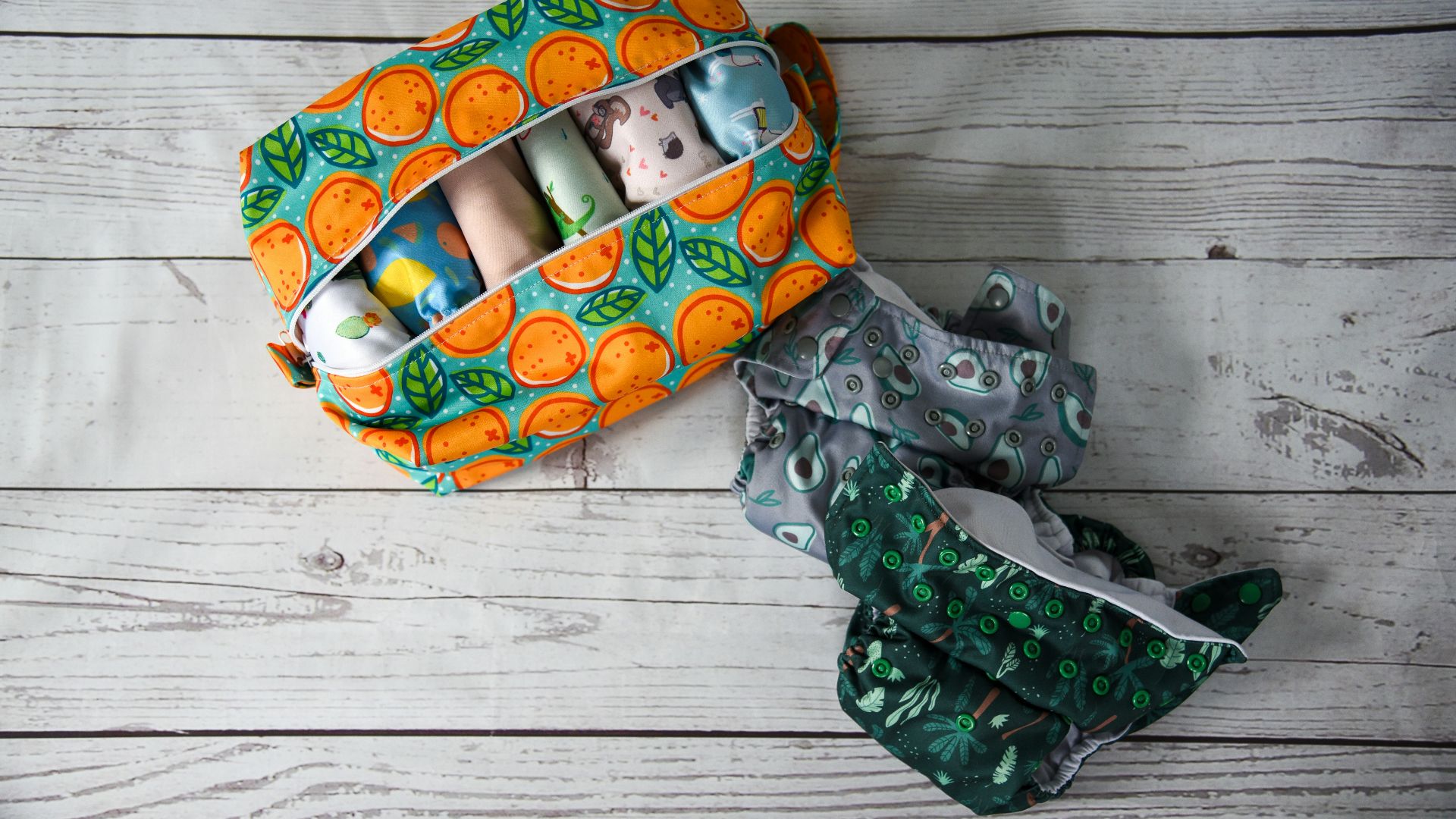 an orange and green bag and a pair of scissors