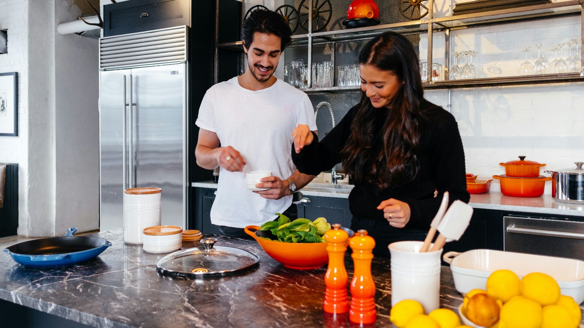 man and woman cooking