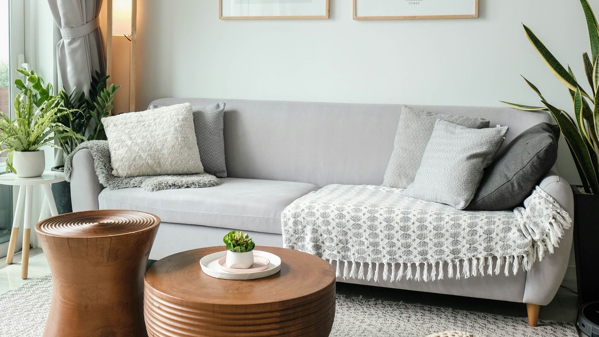 a living room filled with furniture and a large window
