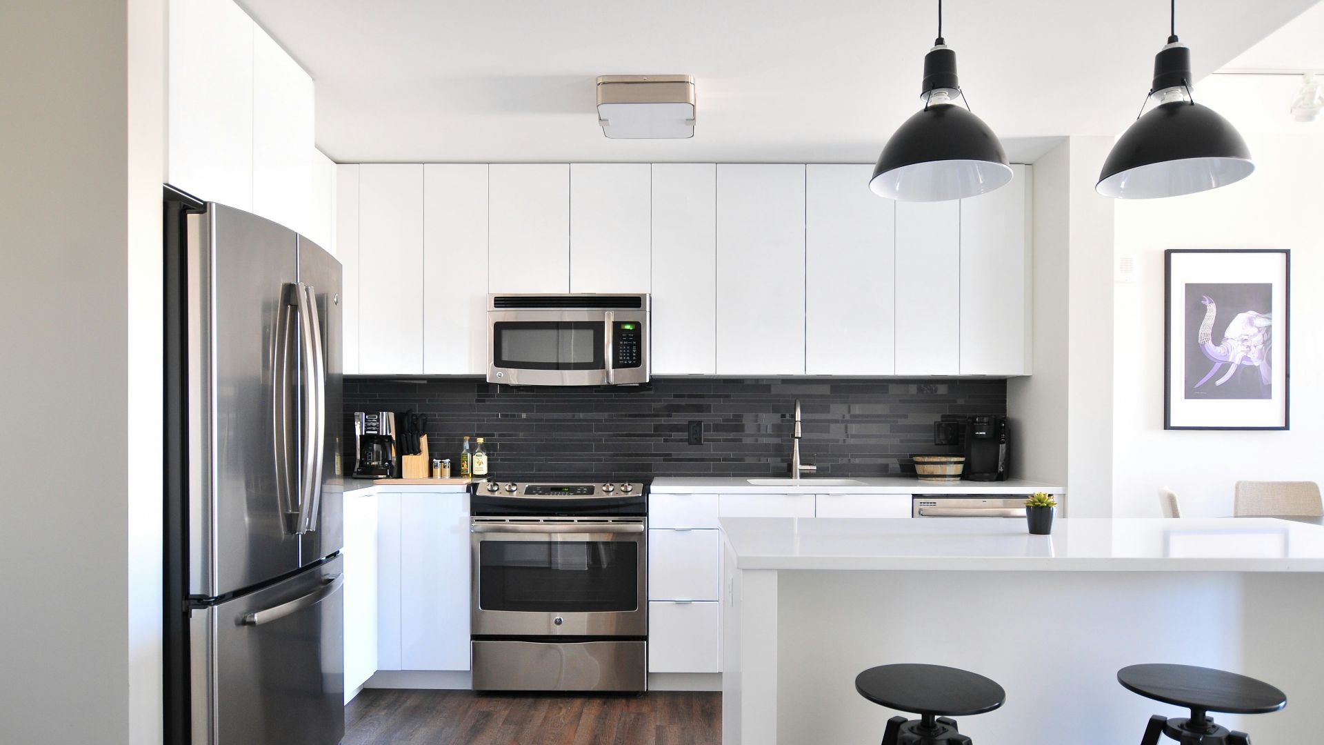 gray steel 3-door refrigerator near modular kitchen