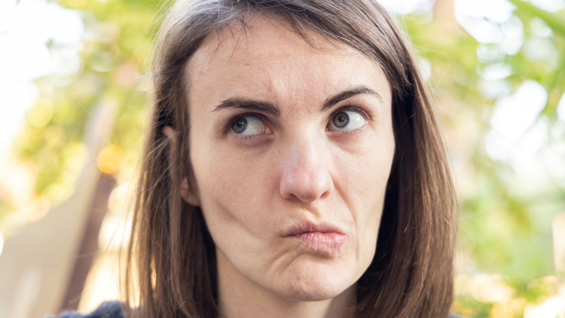 a close up of a person with a surprised look on their face