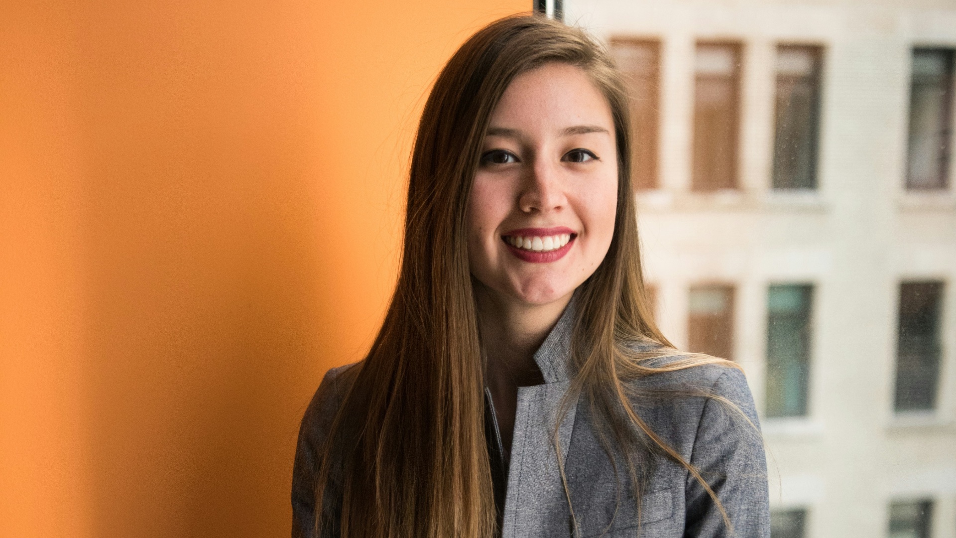 shallow focus photo of woman in gray jacket
