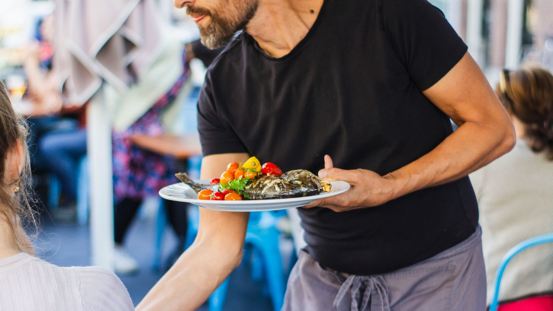 man standing and holding plate