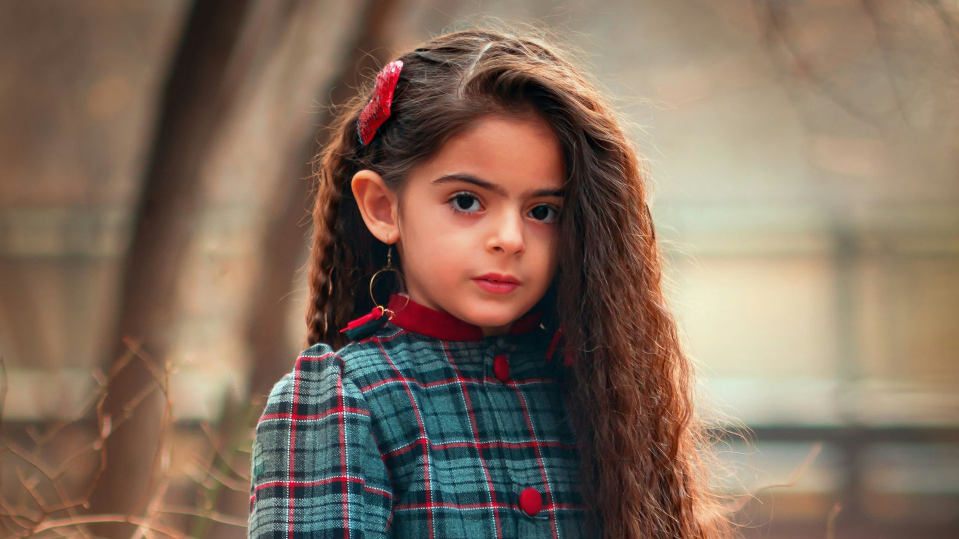 girl standing near tree