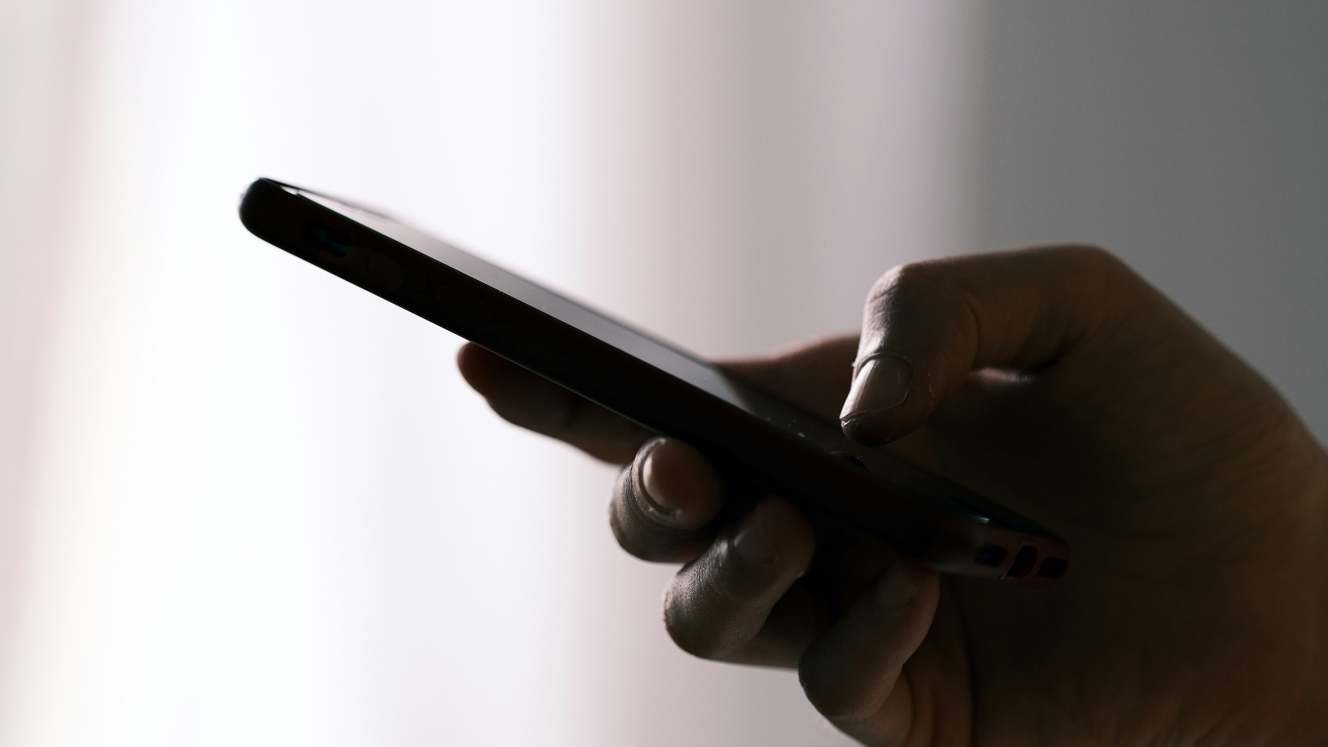 person holding black android smartphone