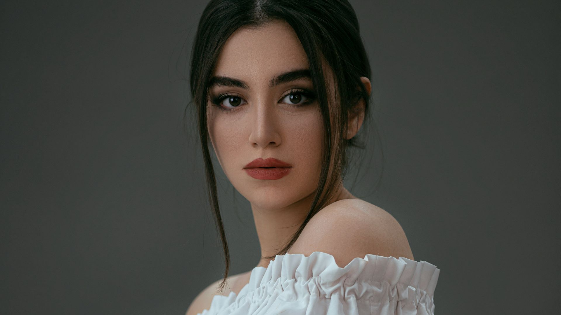 woman in white off shoulder dress