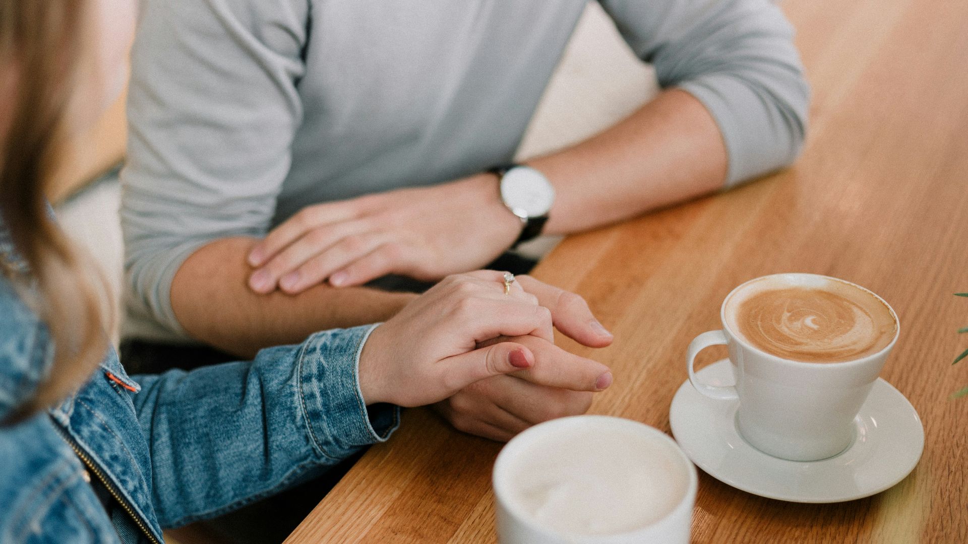 man and woman holding hands