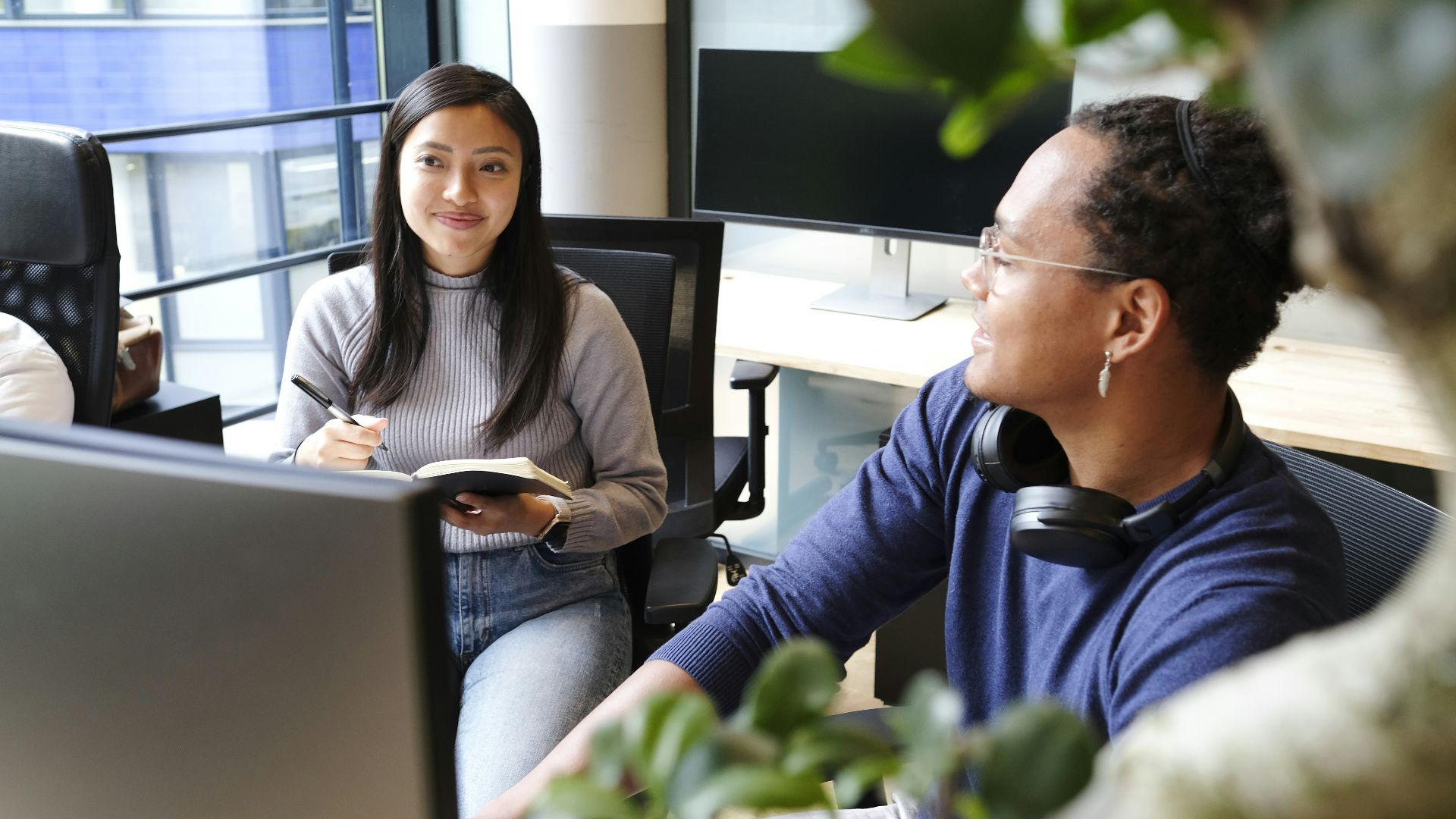 man and woman sitting on chair