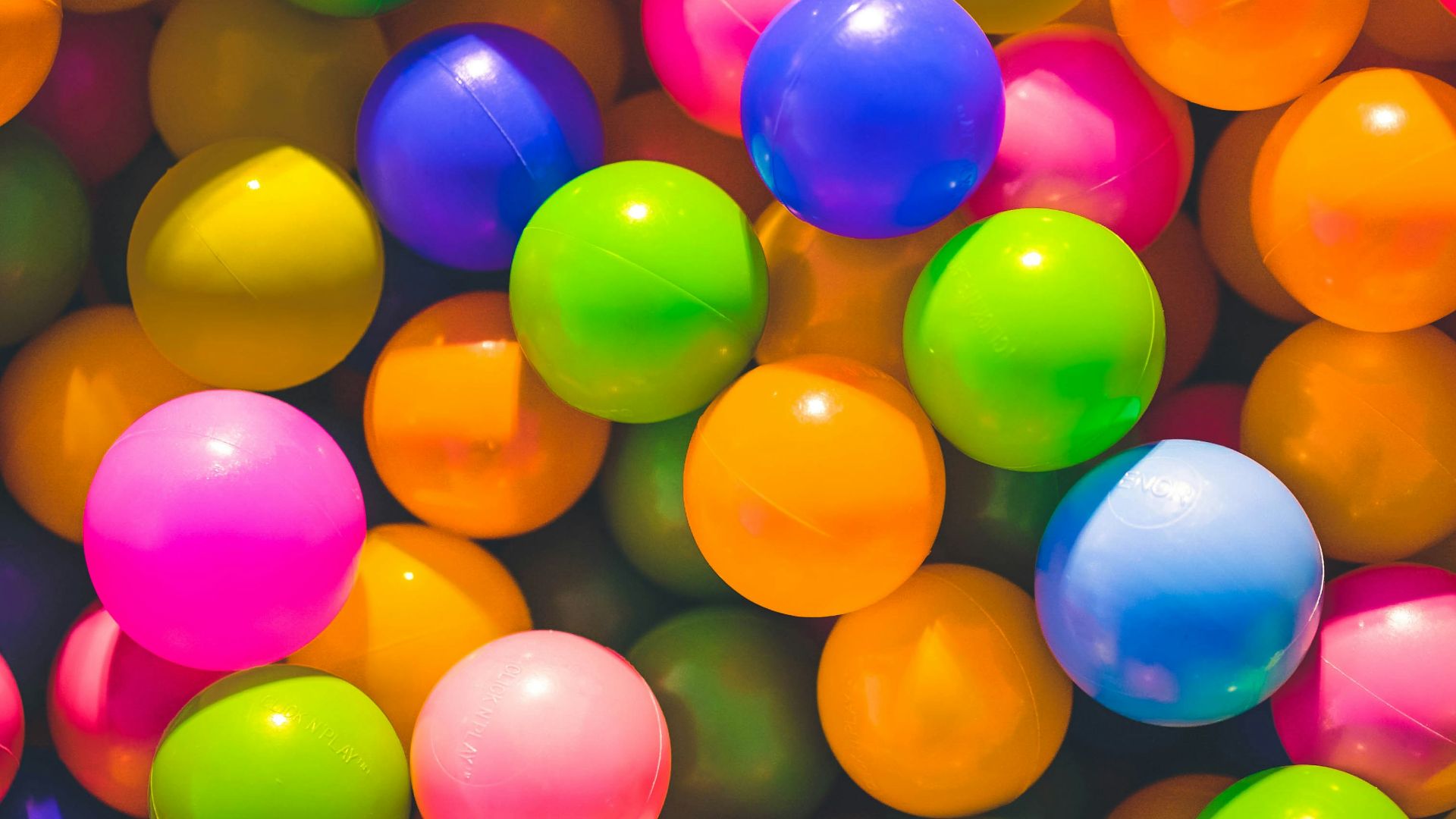 high angle photo of assorted-color plastic balls