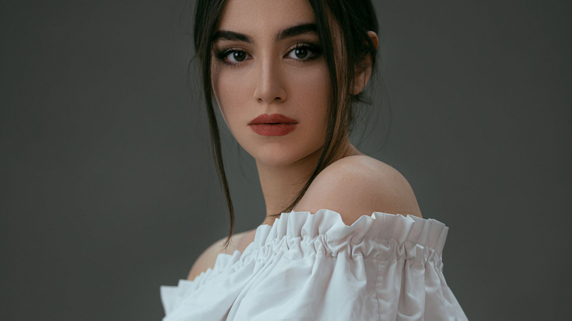 woman in white off shoulder dress