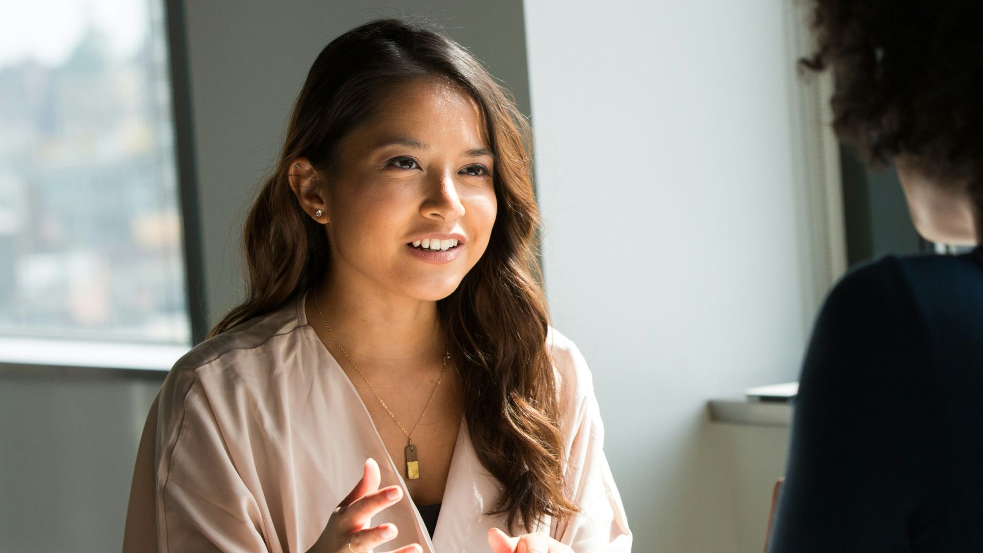 two women sitting on chair