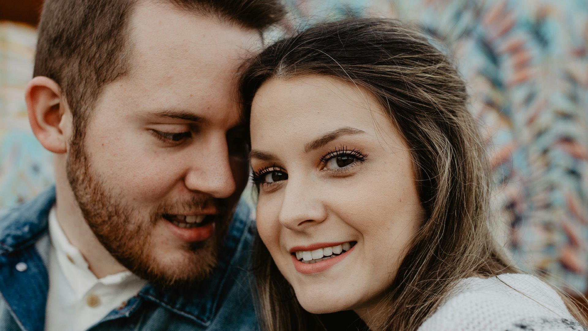 woman and man wearing white sweater