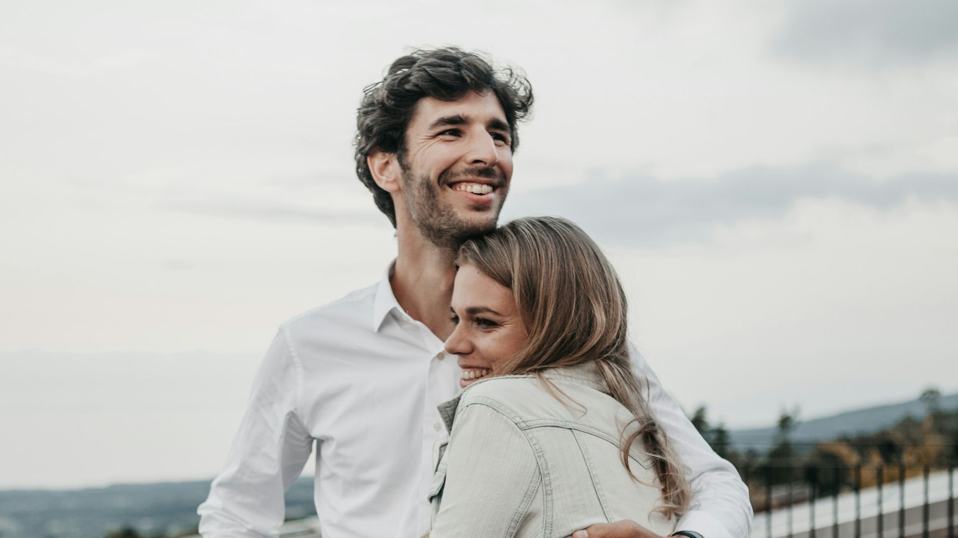 man and woman hugging each other