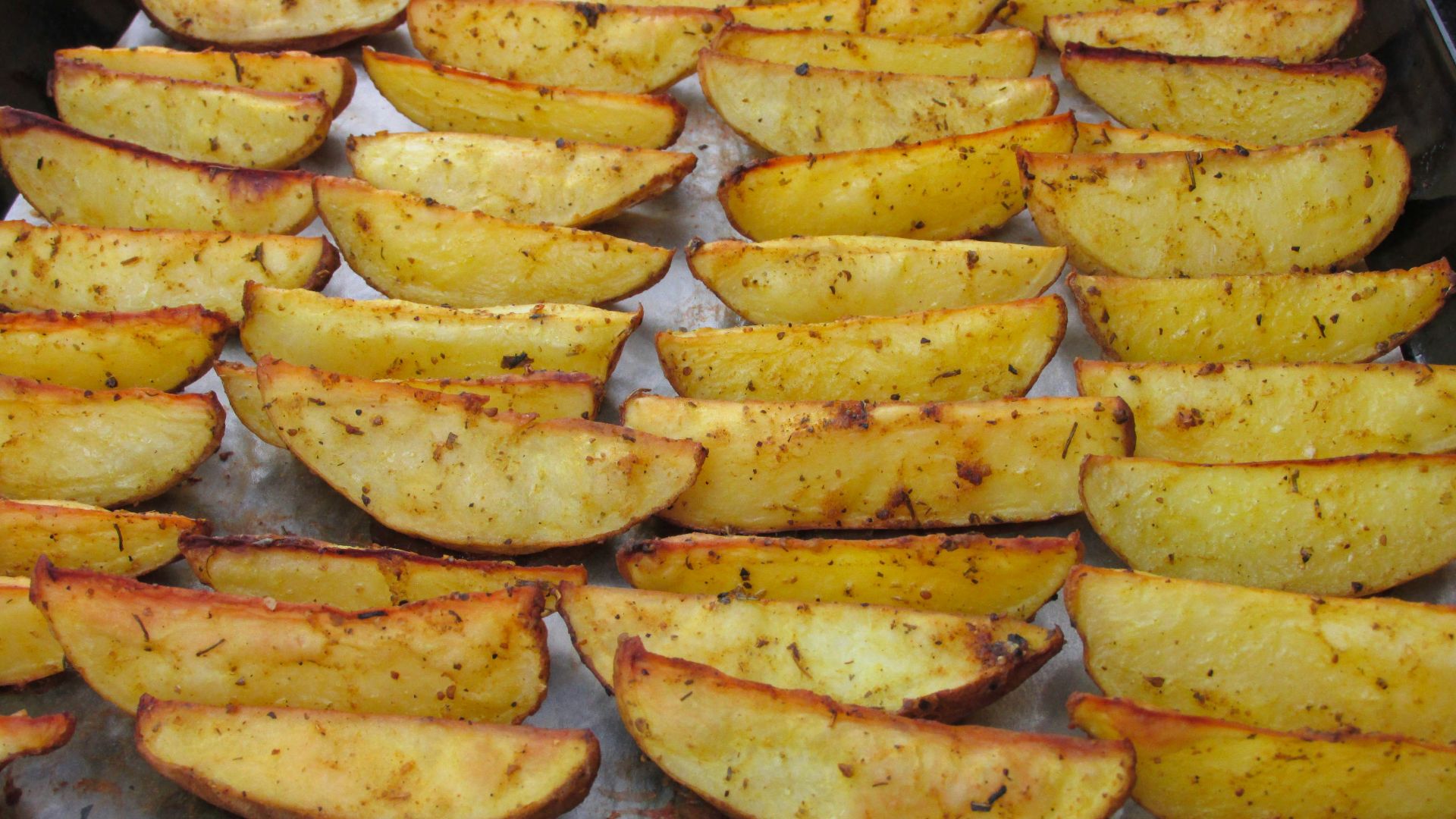 a pan filled with cooked potatoes on top of a table
