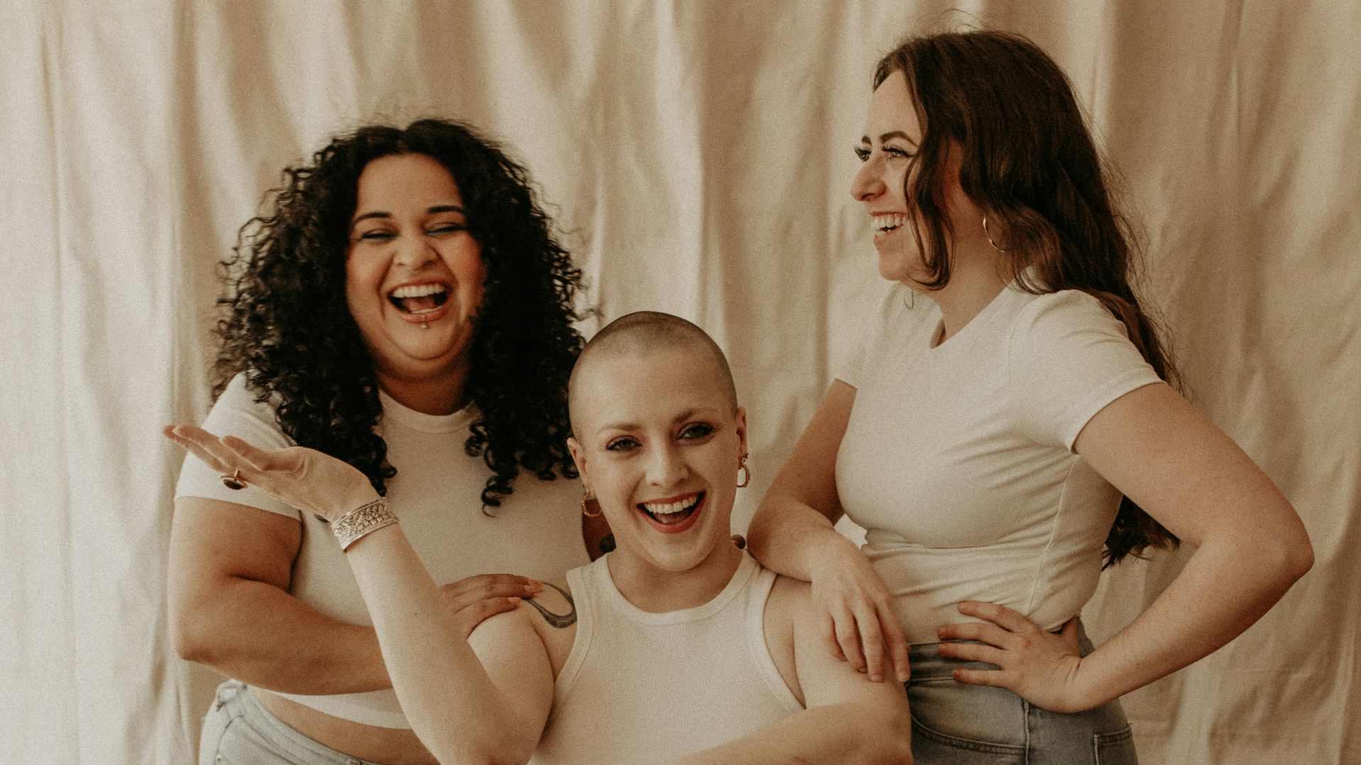three women and a boy posing for a picture