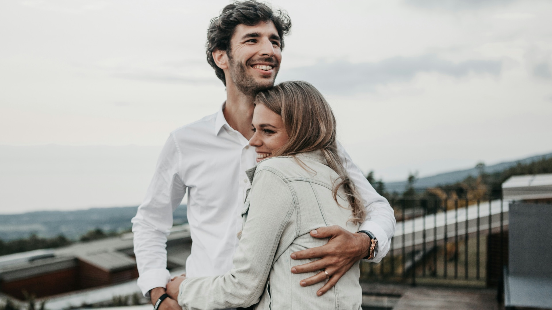 man and woman hugging each other