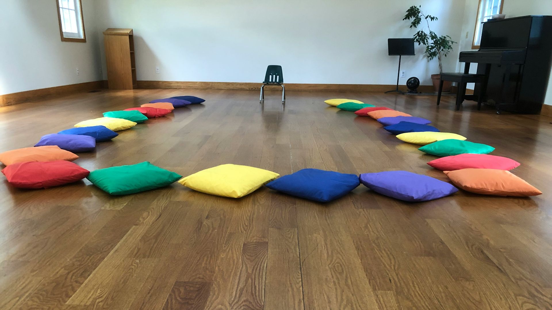 assorted-color throw pillows on the floor