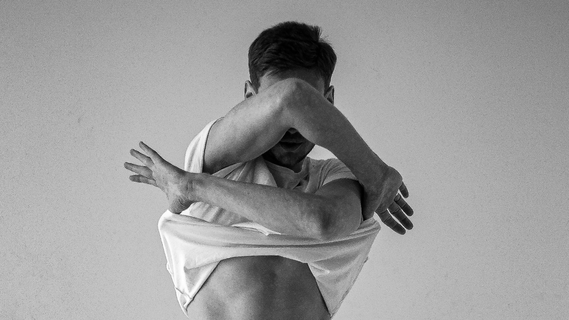 woman in white sports bra and black pants