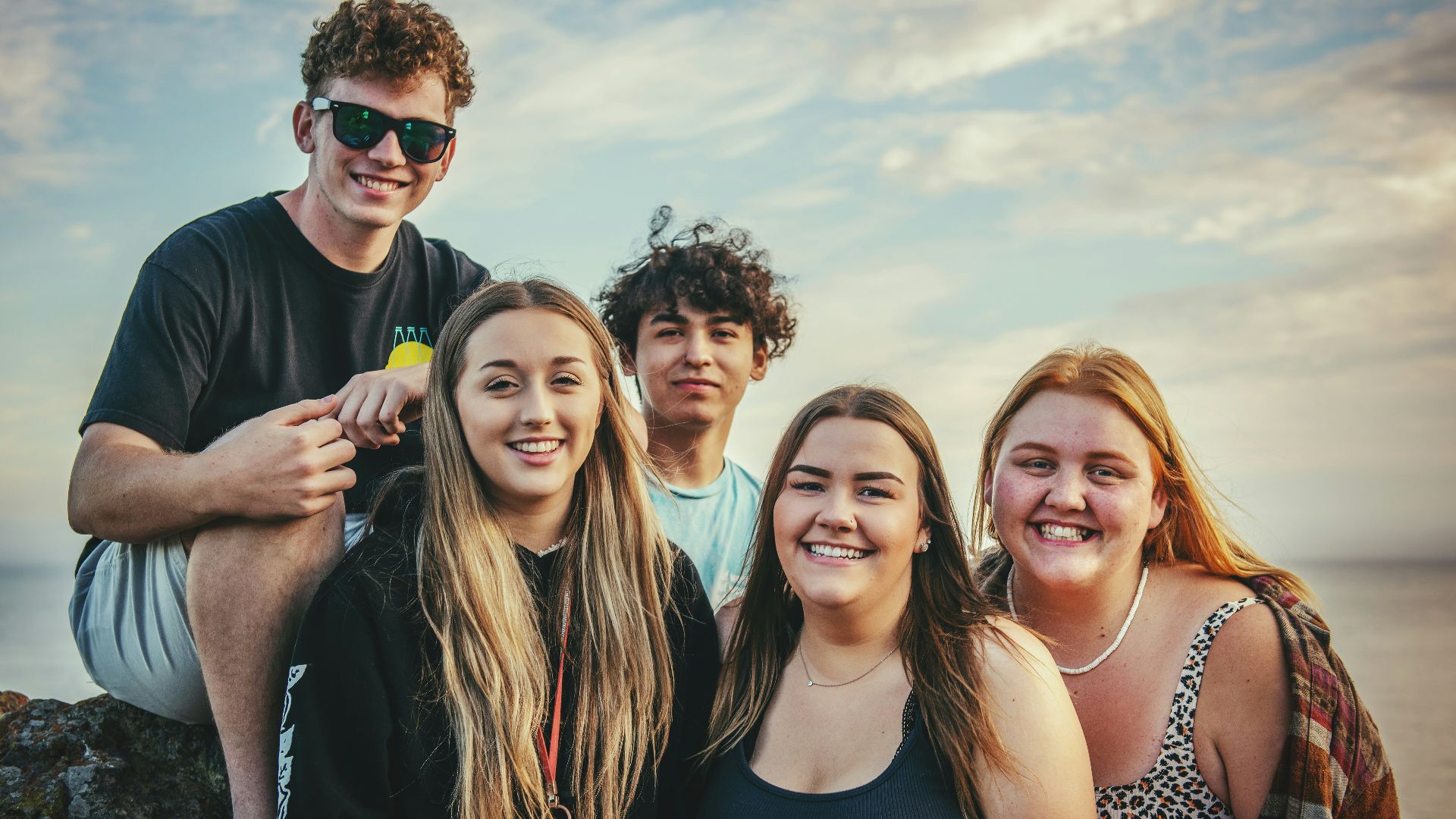 photography of five people near outdoor during daytime