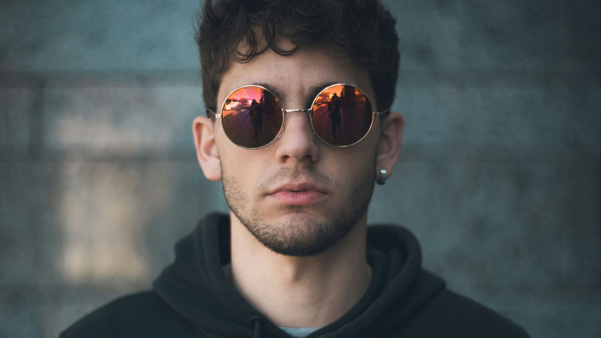 man standing wearing black Nike hoodie