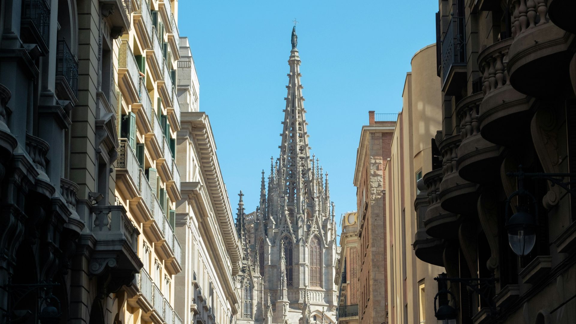 A narrow city street lined with tall buildings