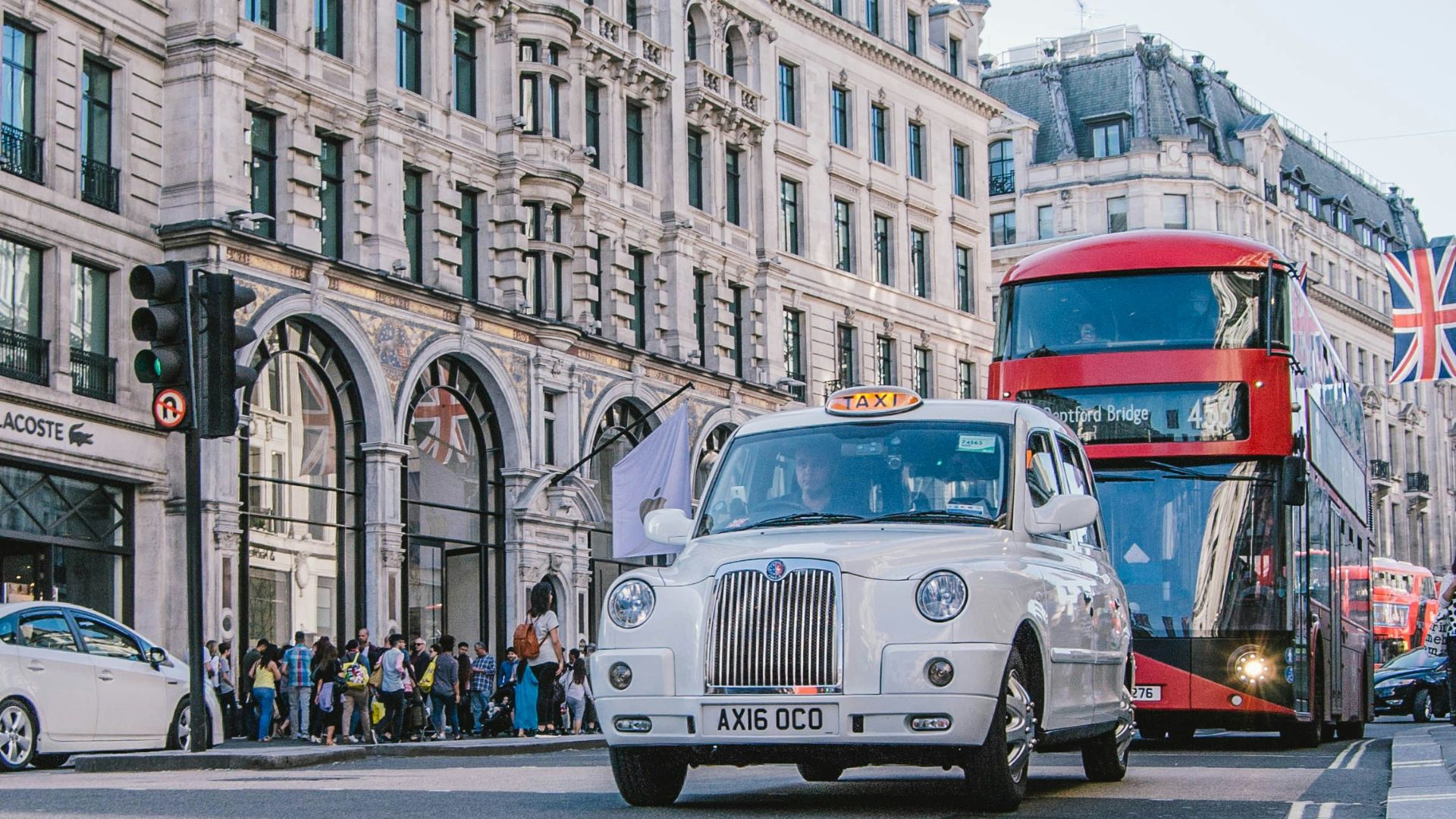 photo of car and bus near castle