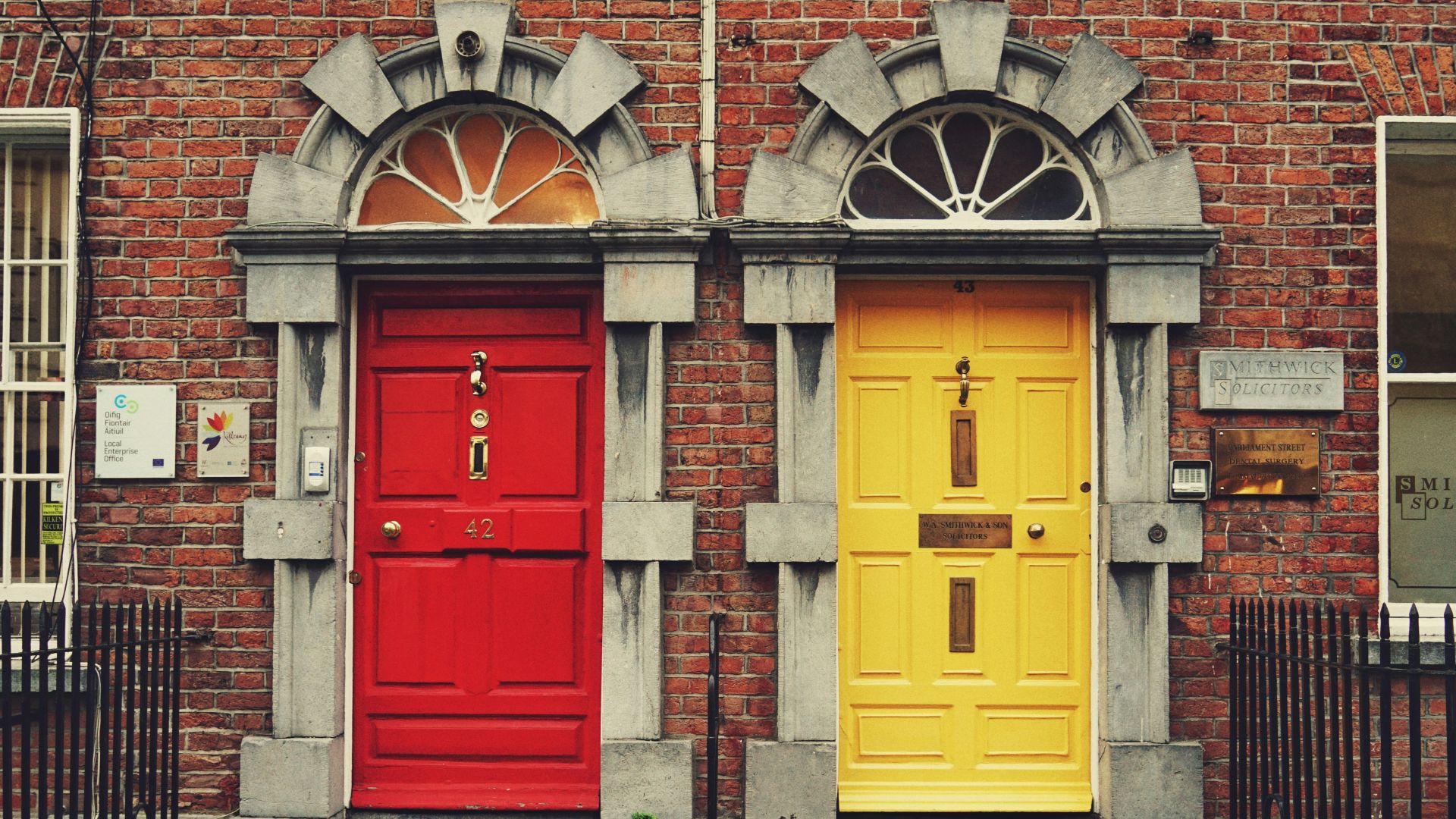 two yellow and red wooden doors