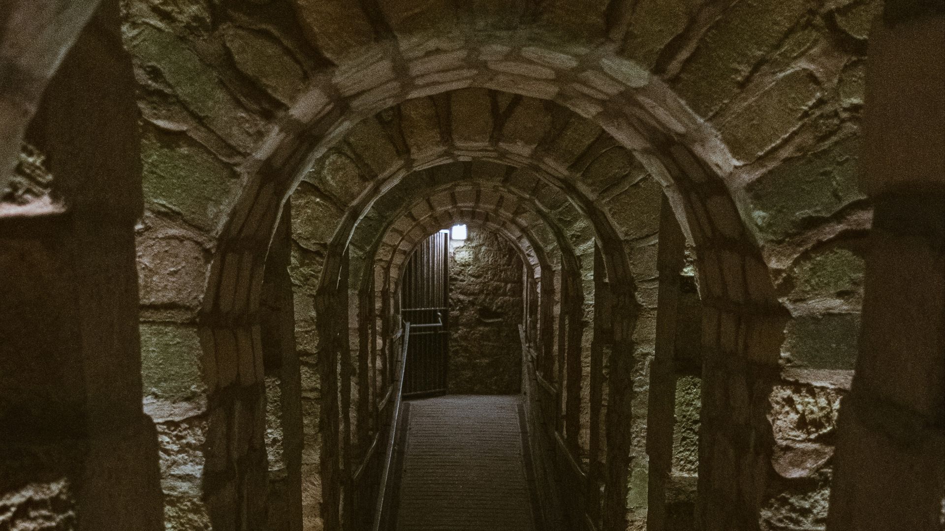 a long tunnel with a light at the end