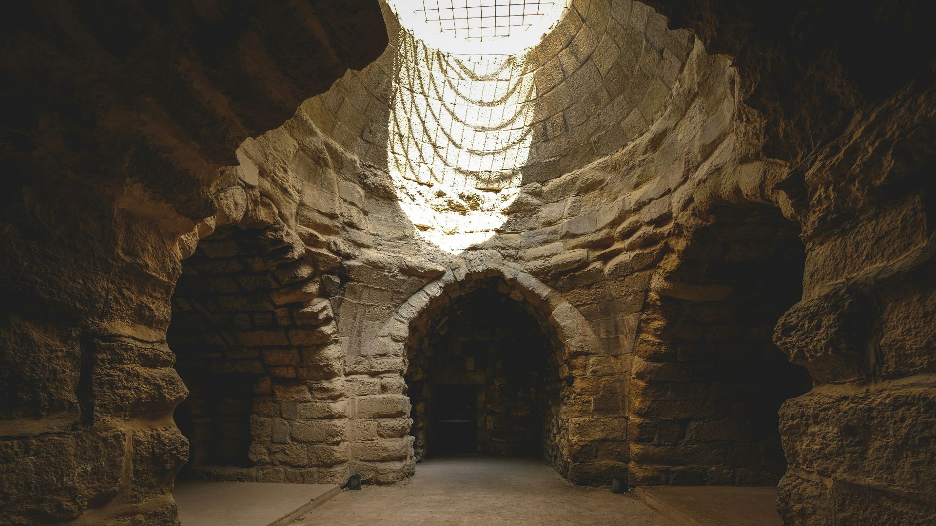 a dark tunnel with a light at the end