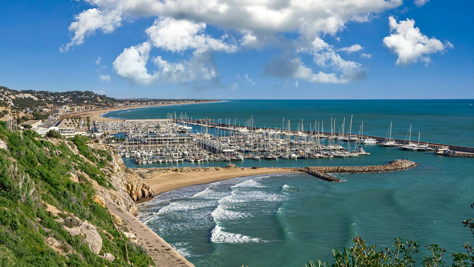 aerial view of city buildings near body of water during daytime
