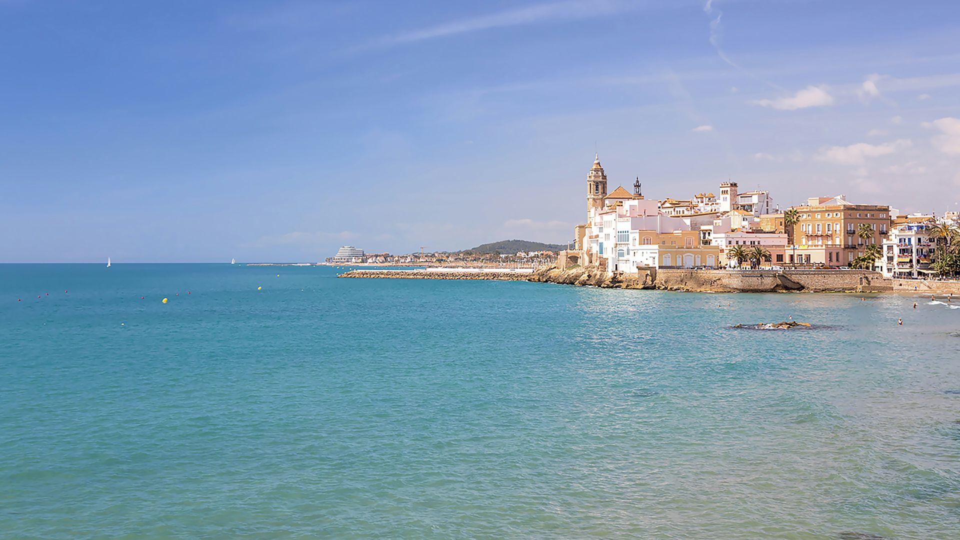 a body of water with buildings in the background