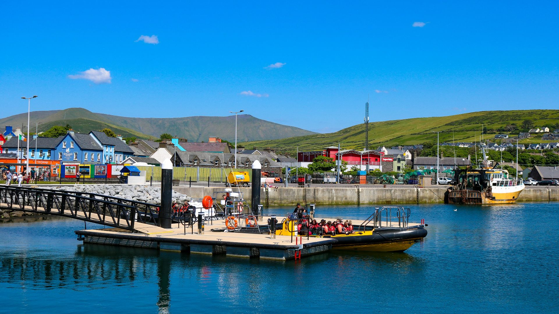 a boat is docked at a pier in the water