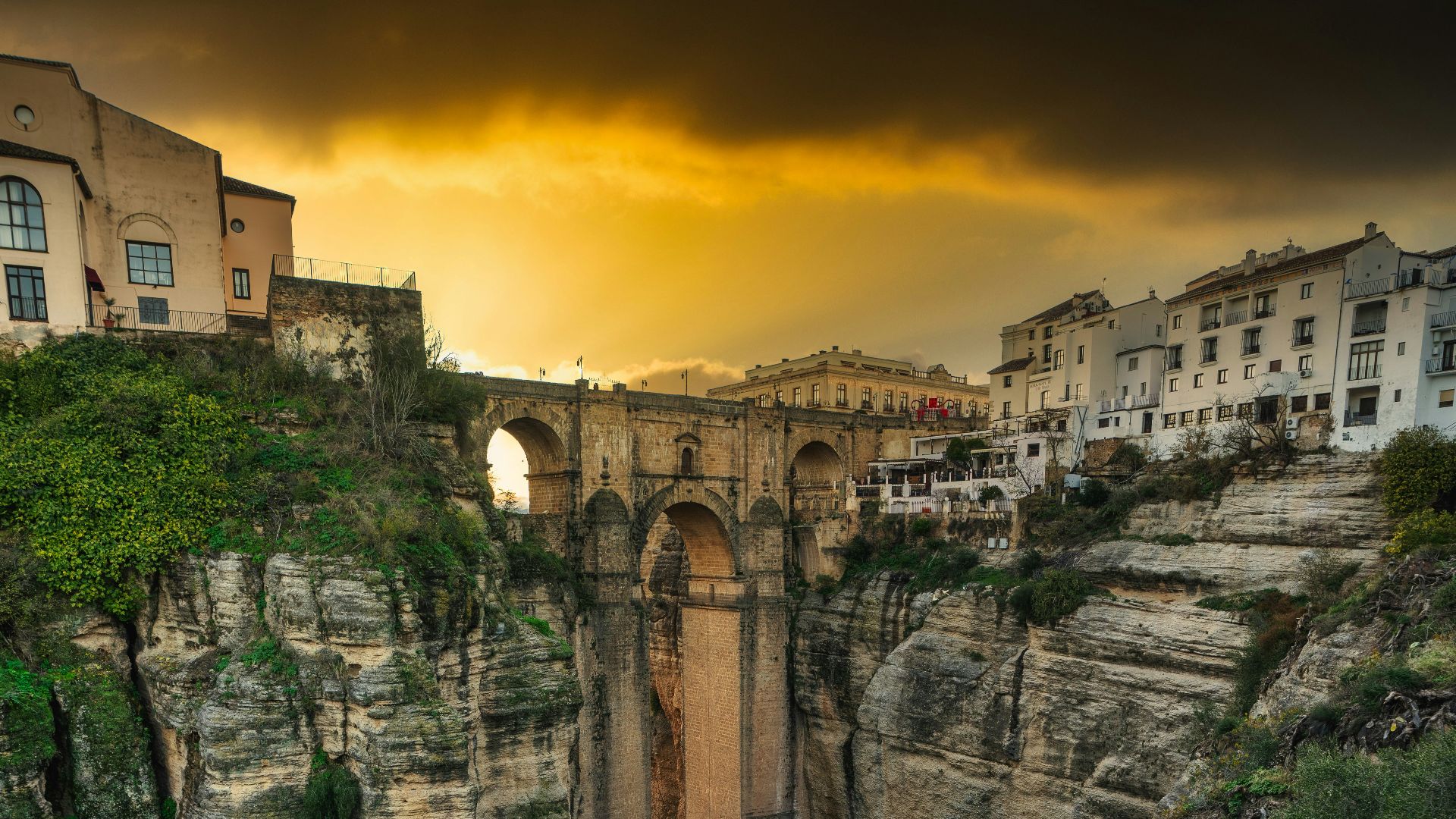 brown concrete building on cliff during daytime