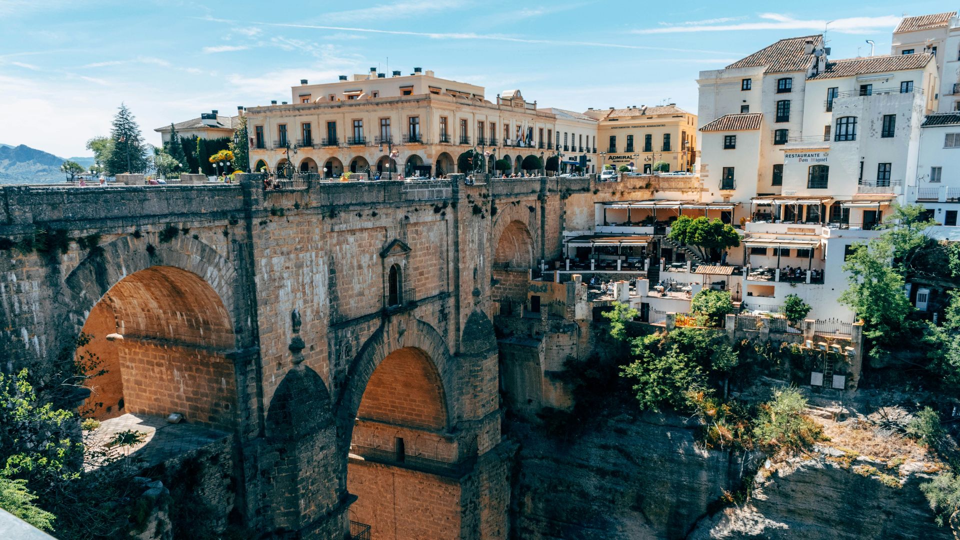 brown concrete building near green trees during daytime