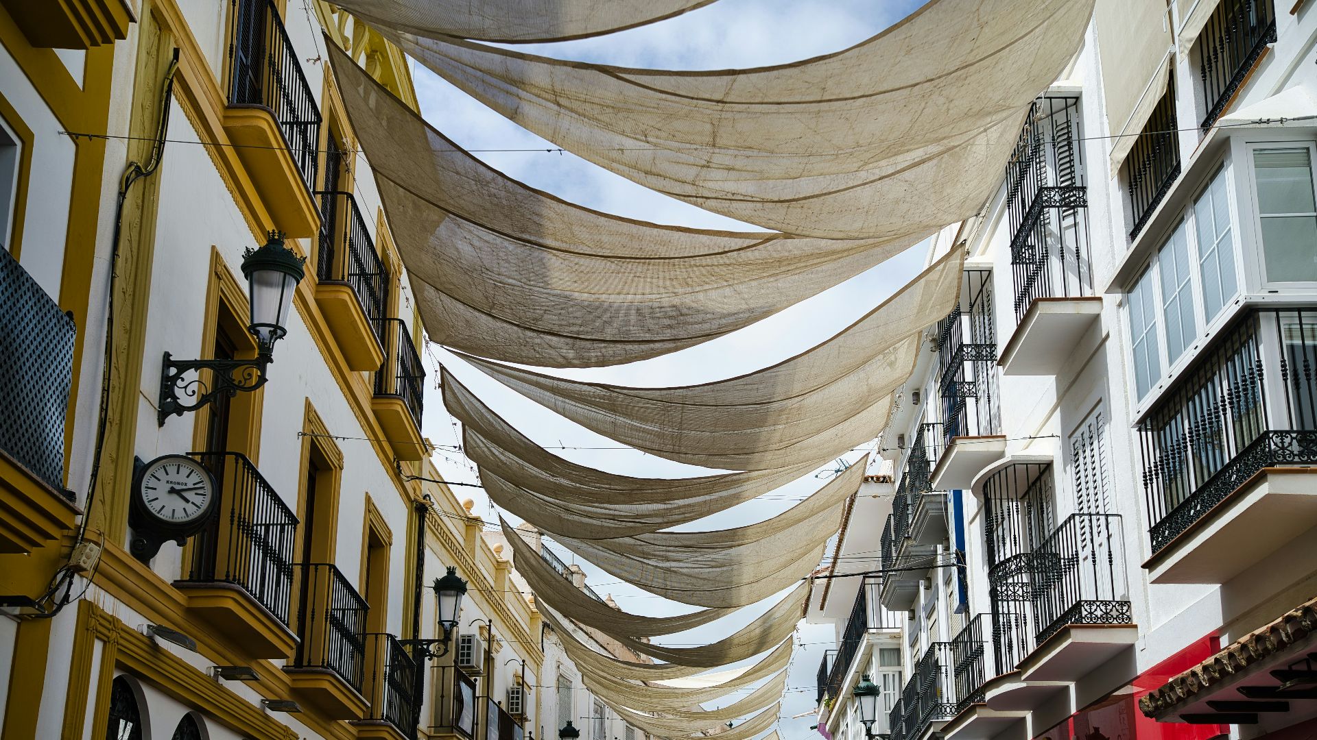 A city street lined with lots of tall buildings