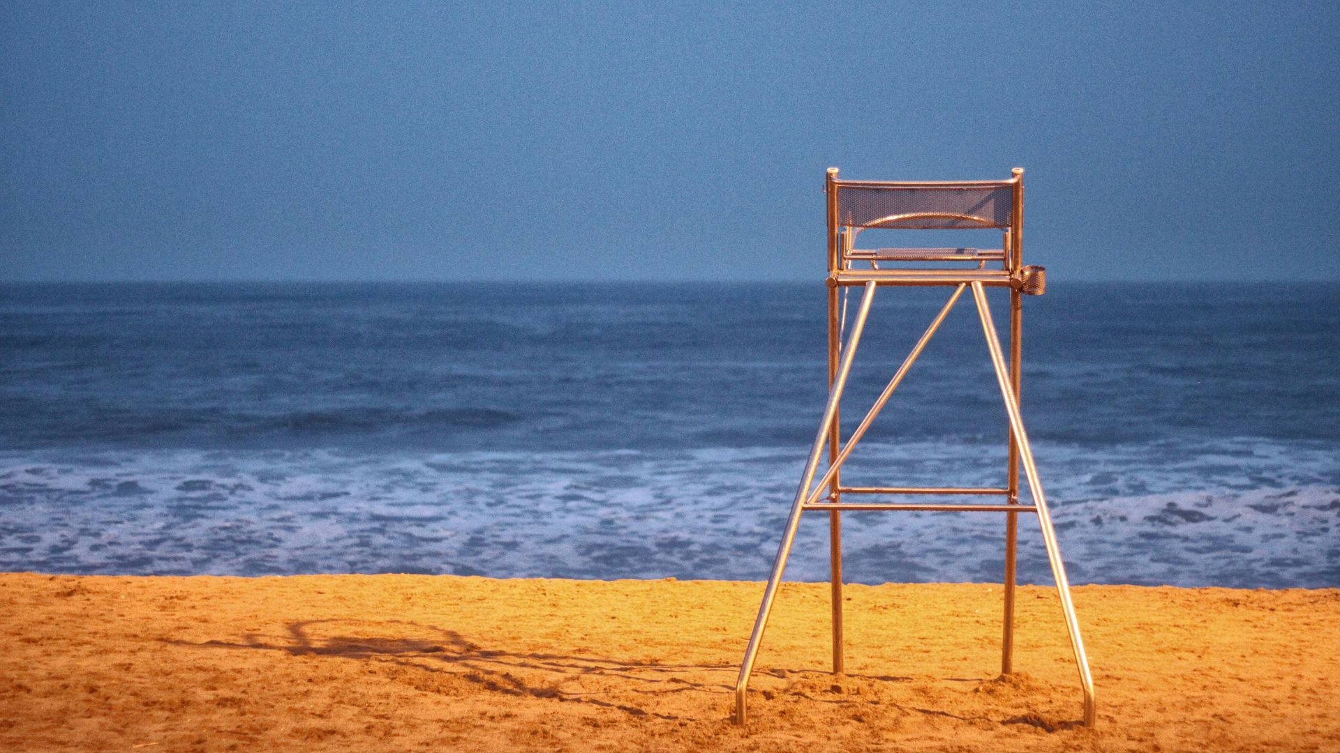 brown wooden ladder on seashore during daytime