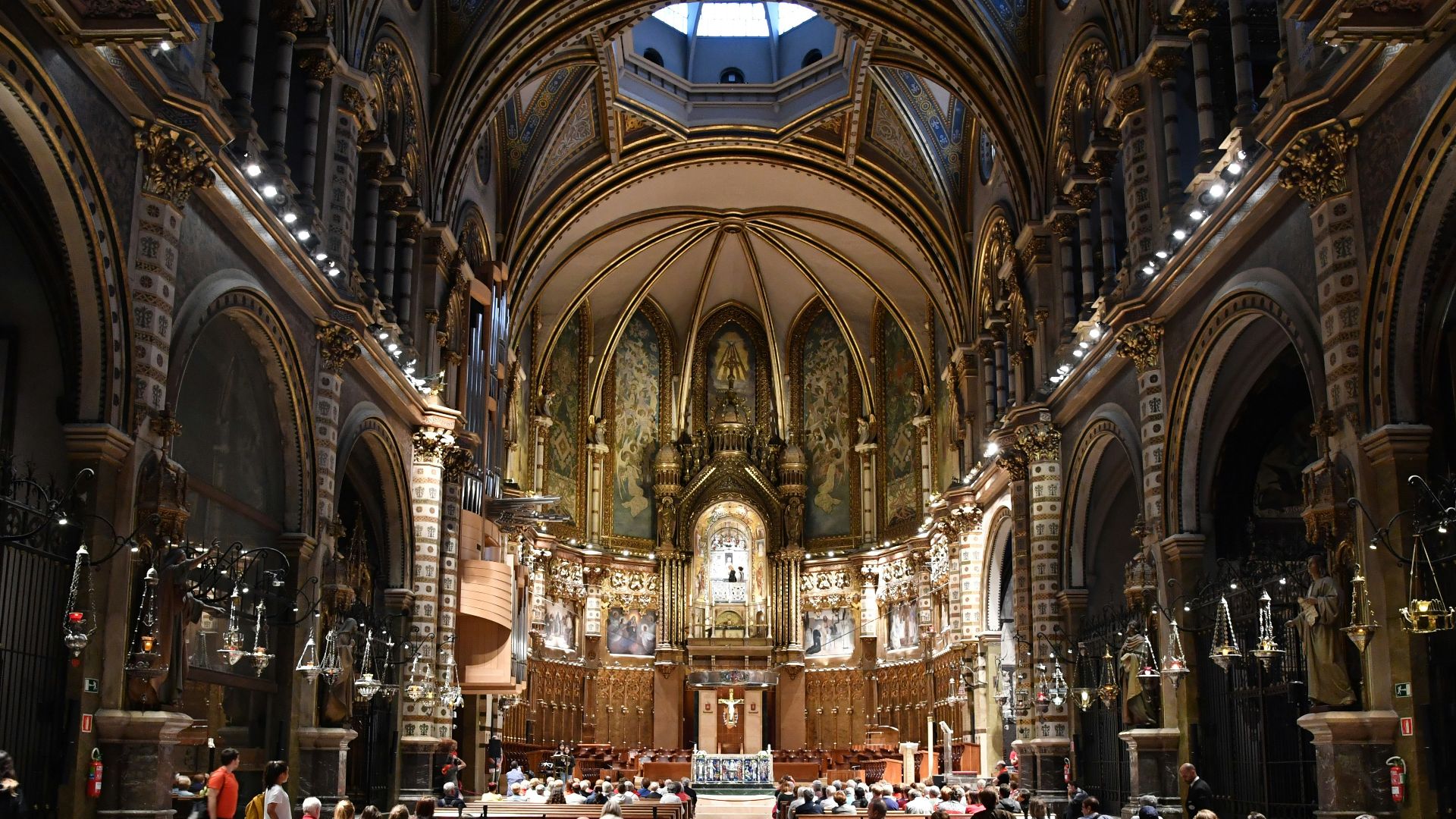 a group of people sitting in pews in a church