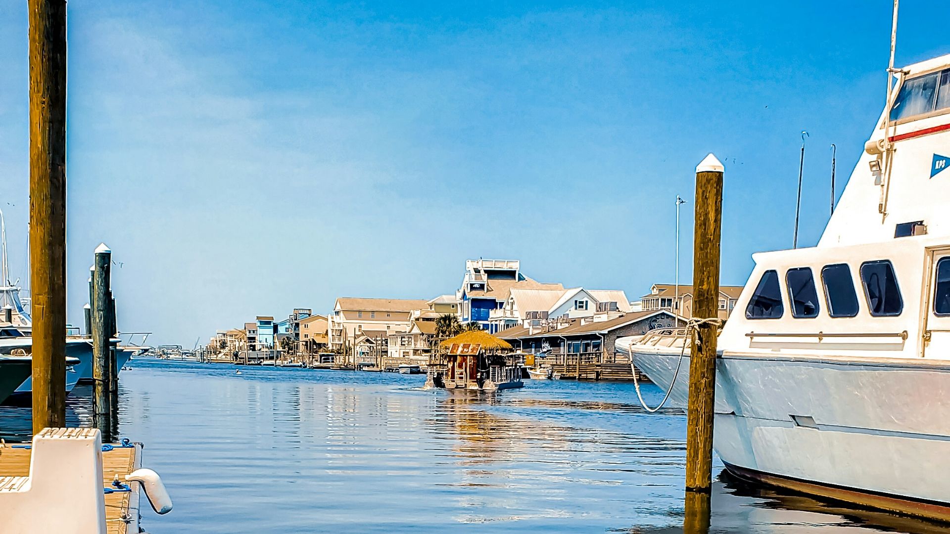 a boat docked at a dock with a rope